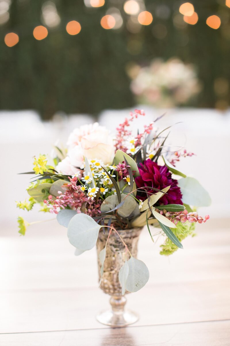Wedding flower centerpiece on wooden table