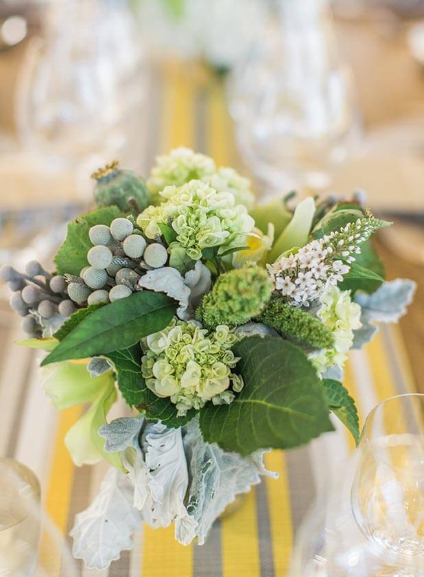 Winery floral décor on set table at Williams Selyem Winery in Healdsburg; floral design by Healdsburg florist Aimee Lomeli Designs