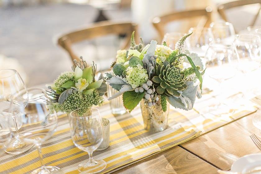 Succulent arrangements on dining table at Williams Seylem Winery venue in Healdsburg; floral design by Healdsburg florist Aimee Lomeli Designs