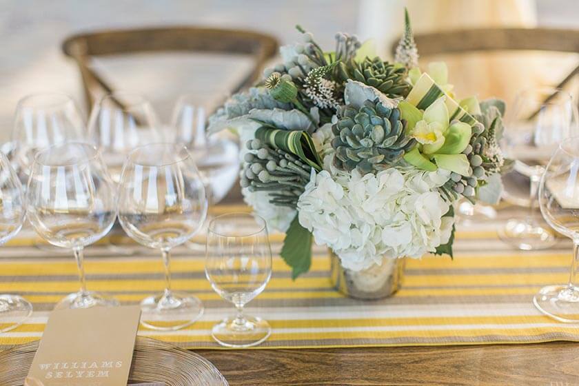 Succulent arrangement centerpiece on dining table at Williams Seylem Winery venue in Healdsburg; floral design by Healdsburg florist Aimee Lomeli Designs