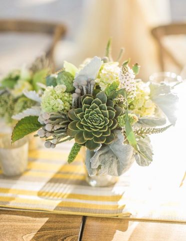 Succulent arrangement centerpiece on dining table at Williams Seylem Winery venue in Healdsburg; floral design by Healdsburg florist Aimee Lomeli Designs