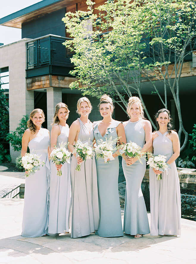 Bridesmaids holding bridesmaid bouqets outdoors at Promontory Winery wedding in Napa