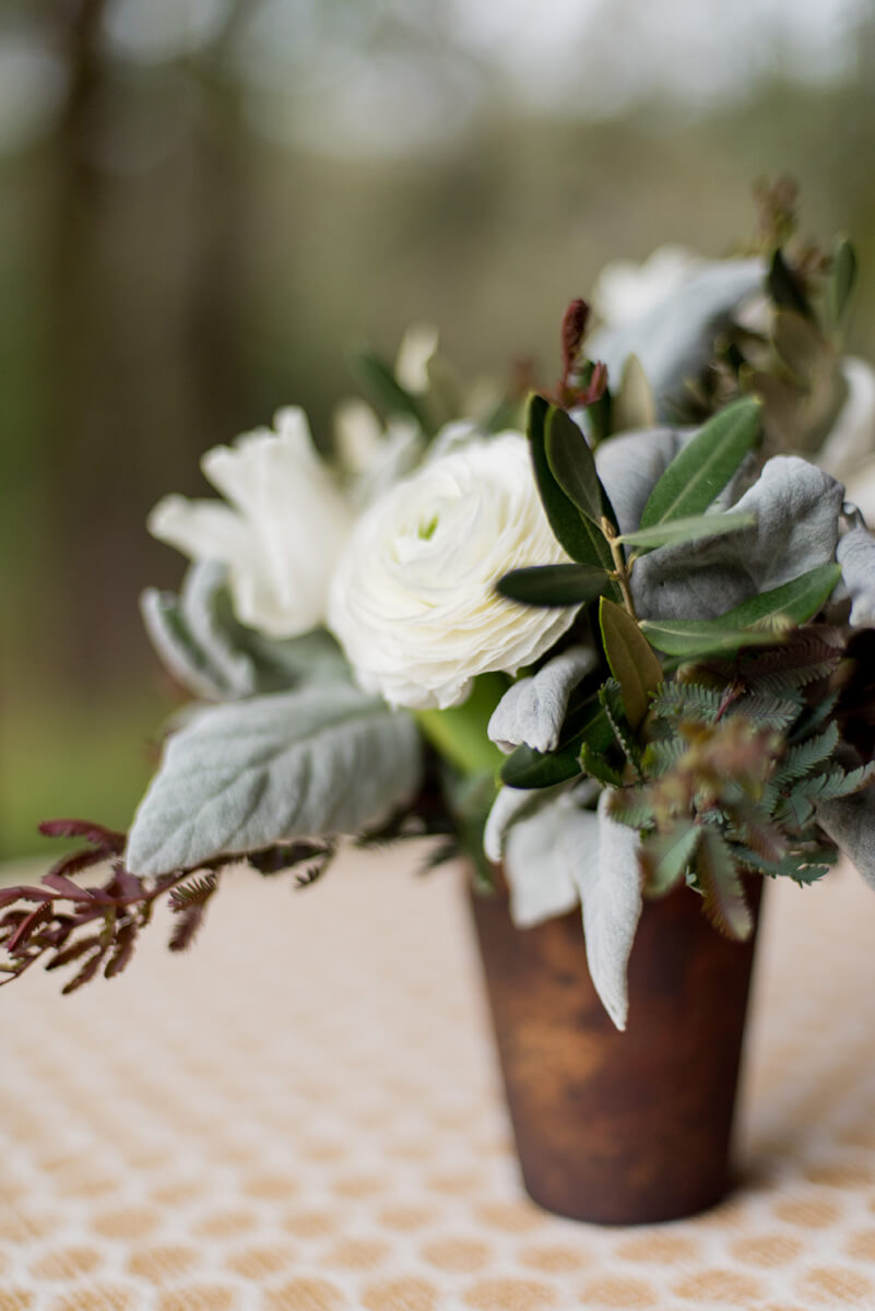 Rustic white flower centerpiece on outdoor table
