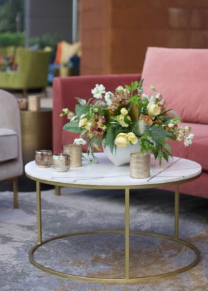 Floral arrangement on circular table near chairs in outdoor venue – floral design by Aimee Lomeli Designs, Sonoma and Napa County florist