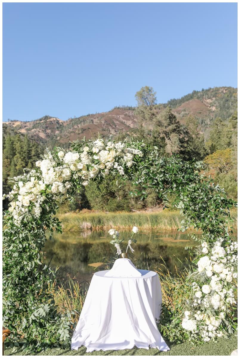 Romantic blue and white round ceremony arch by Aimee Lomeli Designs at Calistoga Ranch Wedding