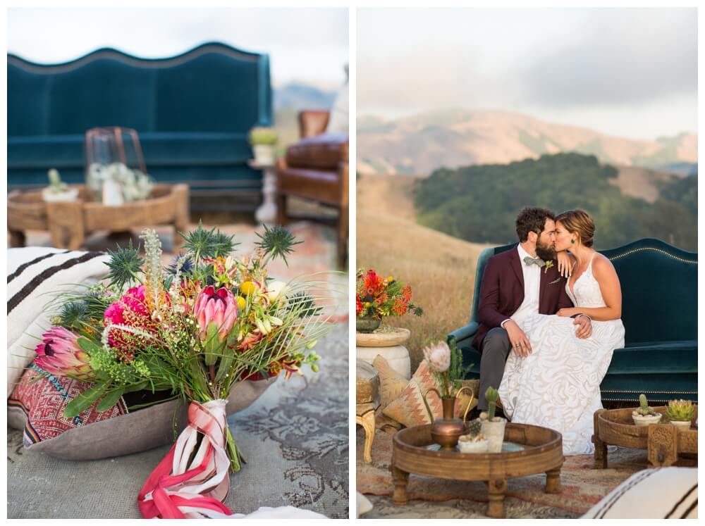 Brightly colored bridal bouquet and a bride and groom kissing on a vintage couch in a field in Sonoma County