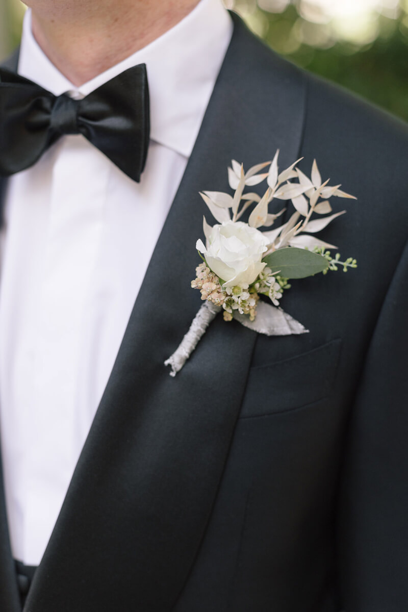 closeup of the groom's boutonniere on his lapel
