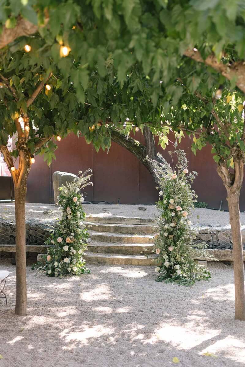 the outdoor wedding aisle at Barndiva in Healdsburg, with a floral altar by Aimee Lomeli Floral Designs